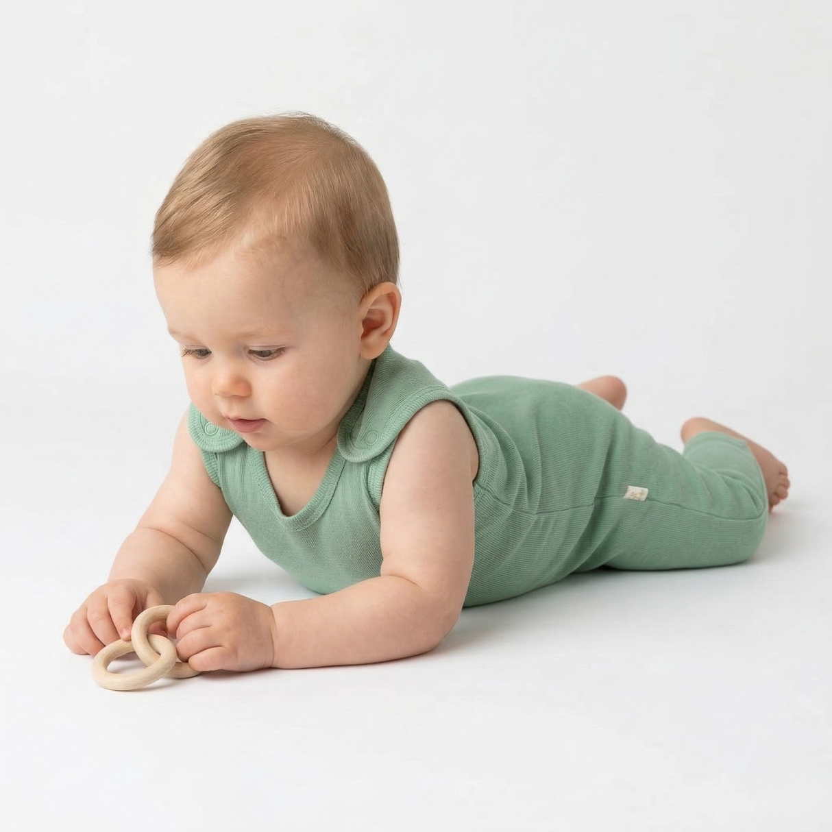 Romper (playsuit) made of 100% organic fine merino with shoulder buttons
